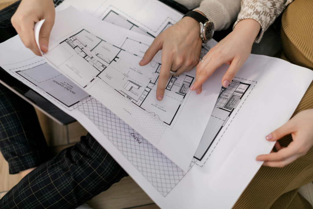 Couple looking at house plans together